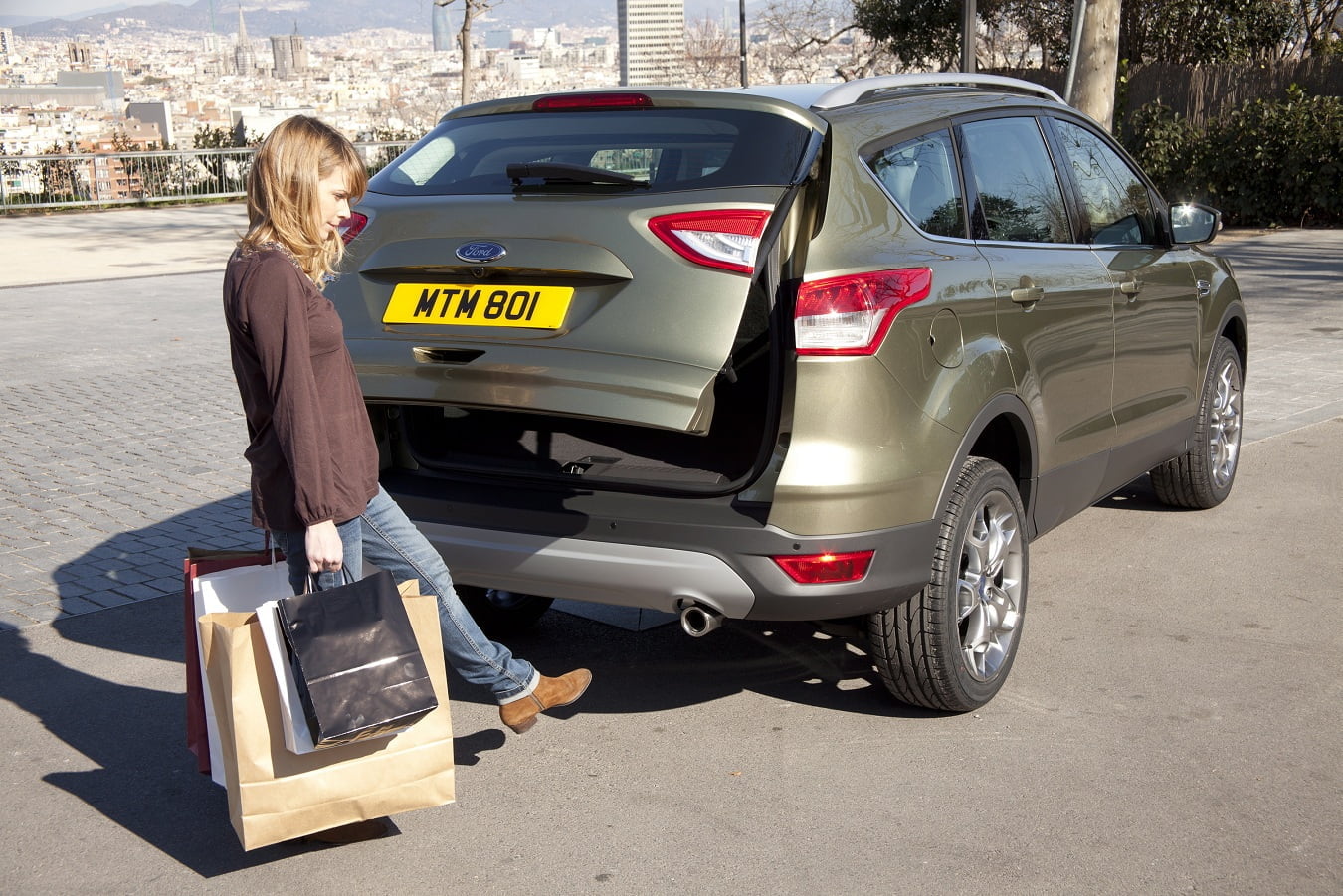 Ford reveals kick-activated automatic tailgate on all-new Kuga, a first-in-segment hands-free system, at the 2012 Geneva Motor Show. Kuga customers will be able to open and close the tailgate simply by waving a foot beneath the rear bumper, an especially useful feature for those carrying groceries or other gear to load into the vehicle. Two sensors in the rear bumper detect a person's shin and kicking motion. The system safeguards against accidental opening by being programmed to open with leg motions - not when an animal runs under the car or when the vehicle hits a bump on the road. (03/05/12)